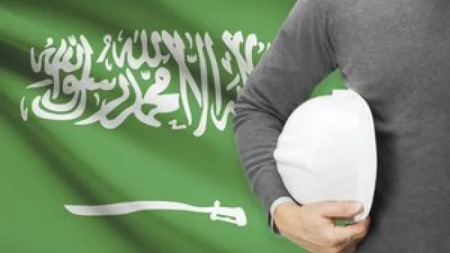 Saudi flag with workman